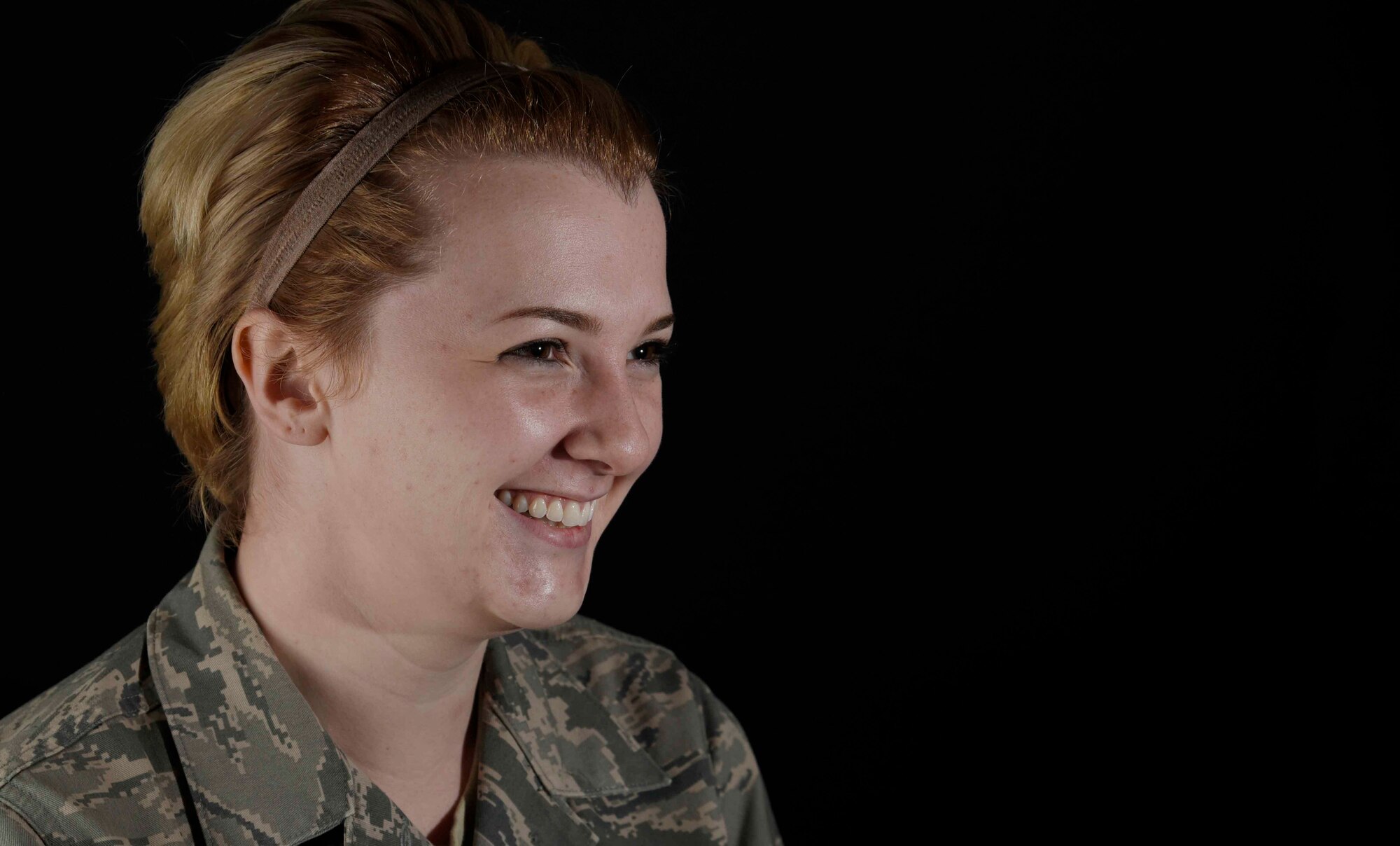 U.S. Air Force Airman 1st Class Camille Van Atta, 35th Fighter Wing community support coordinator administration assistant, poses for a picture at Misawa Air Base, Japan, Oct. 14, 2015. Van Atta was able to overcome an eating disorder with the help of friends and perseverance. She decided to share her story during Resilient Airman Day in front of more than 250 people. (U.S. Air Force photo by Airman 1st Class Jordyn Fetter/Released)