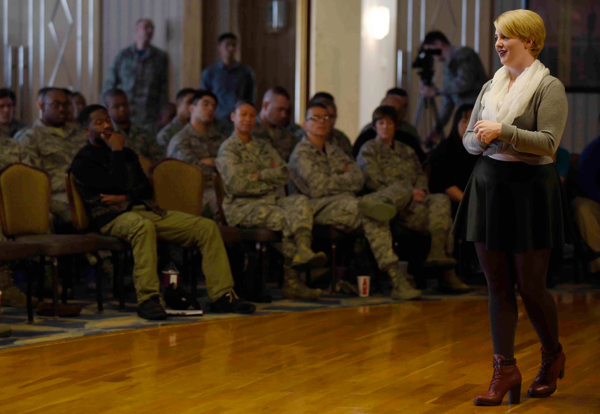U.S. Air Force Airman 1st Class Camille Van Atta, 35th Fighter Wing community support coordinator administration assistant, speaks to an audience at Misawa Air Base, Japan, Oct. 2, 2015. Van Atta took part in the ?Tell Your Story? event for Resilient Airman Day to share how she persevered through an internal struggle. She now embodies the physical fitness pillar of resiliency by leading a healthy lifestyle. (U.S. Air Force photo by Airman 1st Class Jordyn Fetter/Released)