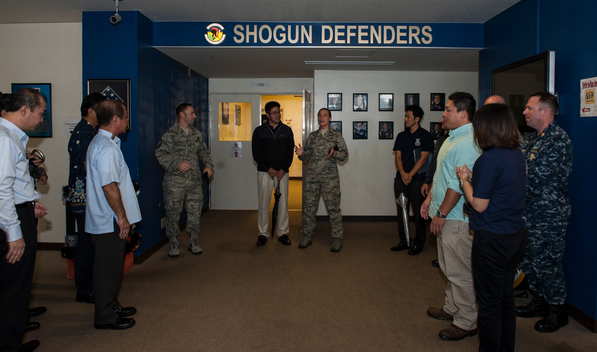 U.S. Air Force Lt. Col. Sarah Babbitt, 18th Security Forces Squadron commander, briefs Okinawa Police Station members during the Inaugural Law Enforcement Officer Exchange Oct. 22, 2015, on Kadena Air Base, Japan. Babbitt spoke about the importance of maintaining healthy relationships with the Okinawan police to maximize the protection of island residents. (U.S. Air Force photo by Airman 1st Class Lynette M. Rolen)