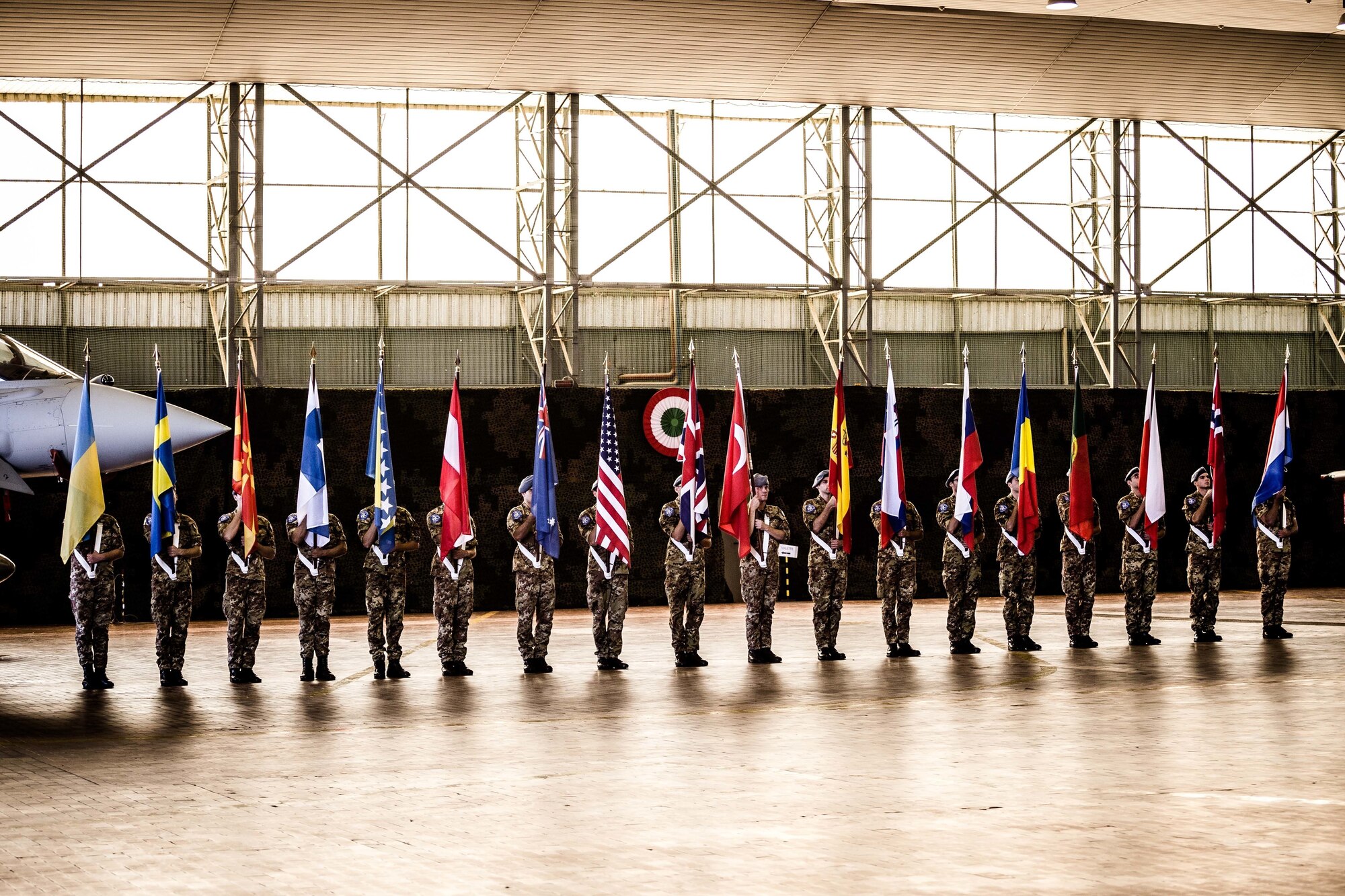 The Trident Juncture 2015 opening ceremony in Trapani, Italy, included a parade of flags of participating nations. (Photo by Miks Uzans/Released)