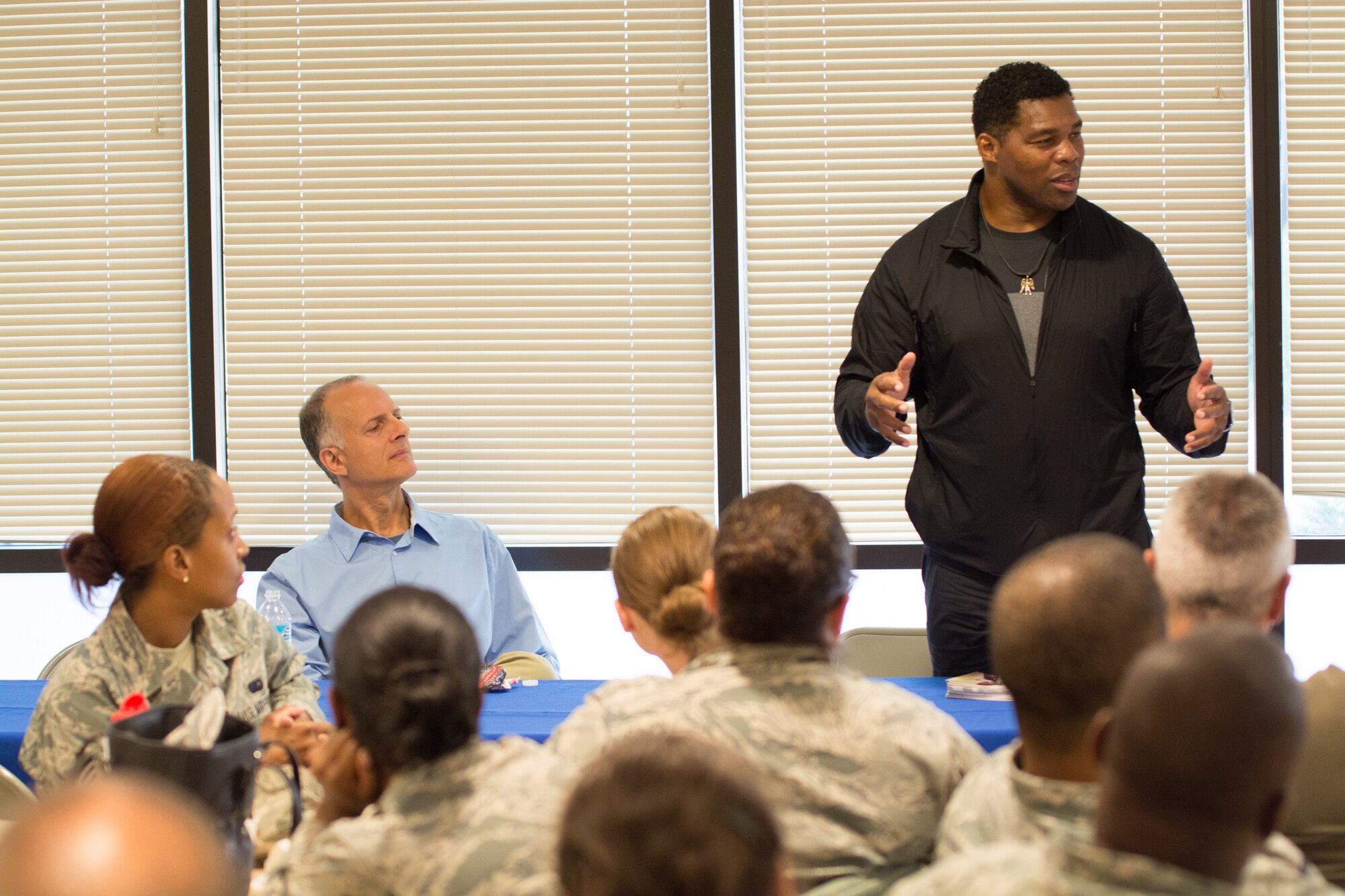 Former NFL player, Herschel Walker speaks to the Air Force Mortuary Affairs Operations team, during a visit Oct. 15, 2015 to the Charles C. Carson Center for Mortuary Affairs, Dover Air Force Base, Del. Walker expressed his gratitude to the men and women of AFMAO for the work they do for the nation’s fallen service members. (U.S. Air Force photo/Sgt. 1st Class Antwon Shaw)