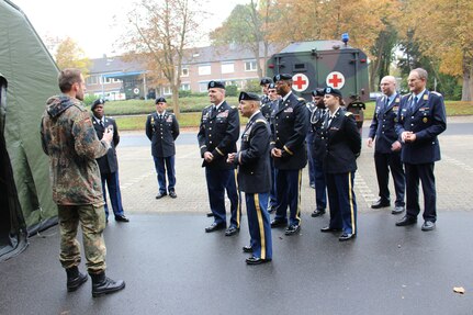 Leaders and Soldiers from the U.S. Army Reserve’s 361st Civil Affairs Brigade listen to a presentation from the staff of the German Bundeswehr Major Medical Clinic Cologne-Wahn, Thursday, Oct. 22, 2015 in Cologne-Wahn, Germany. The 361st signed a partnership agreement with the clinic to formalize combined training opportunities. (Photo by 1st Lt. Luis Villegas, 361st Civil Affairs Brigade)