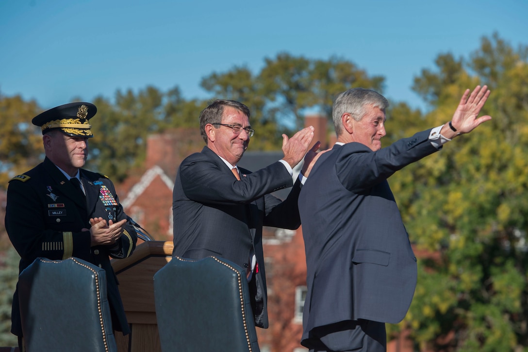 Defense Secretary Ash Carter and Army Chief of Staff Gen. Mark A. Milley applaud after Army Secretary John M. McHugh delivered remarks during a farewell ceremony honoring him on Joint Base Myer-Henderson Hall, Va., Oct. 23, 2015. DoD photo by U.S. Air Force Senior Master Sgt. Adrian Cadiz