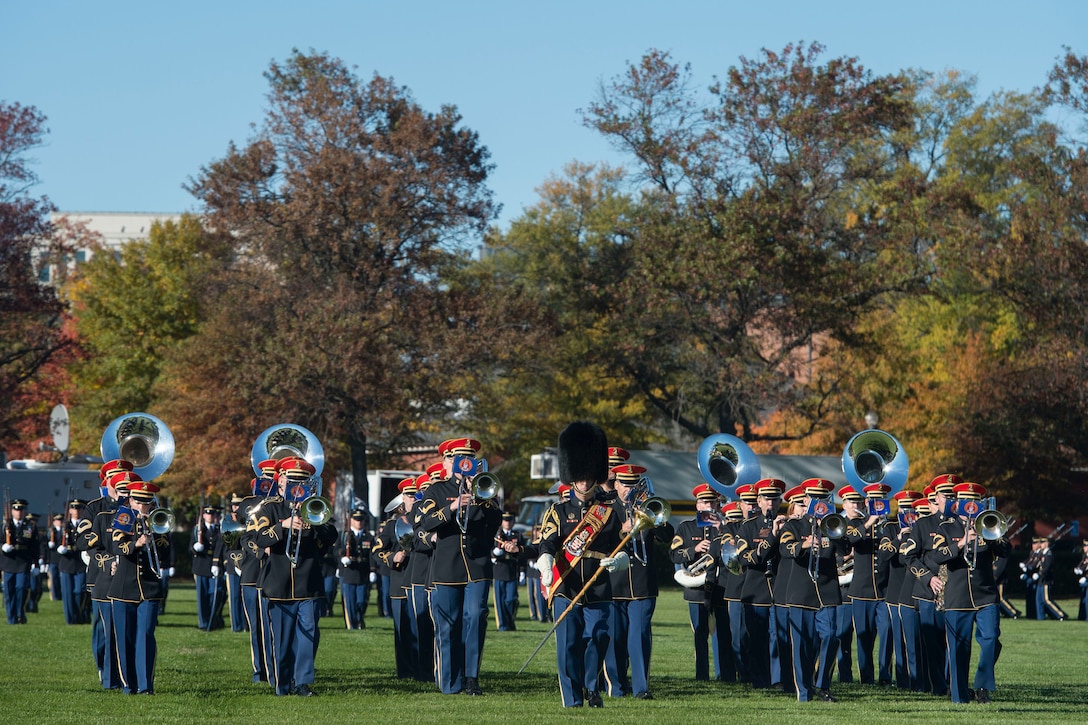 The Army band marches during a farewell ceremony honoring Army Secretary John M. McHugh on Joint Base Myer-Henderson Hall, Va., Oct. 23, 2015.  DoD photo by U.S. Air Force Senior Master Sgt. Adrian Cadiz