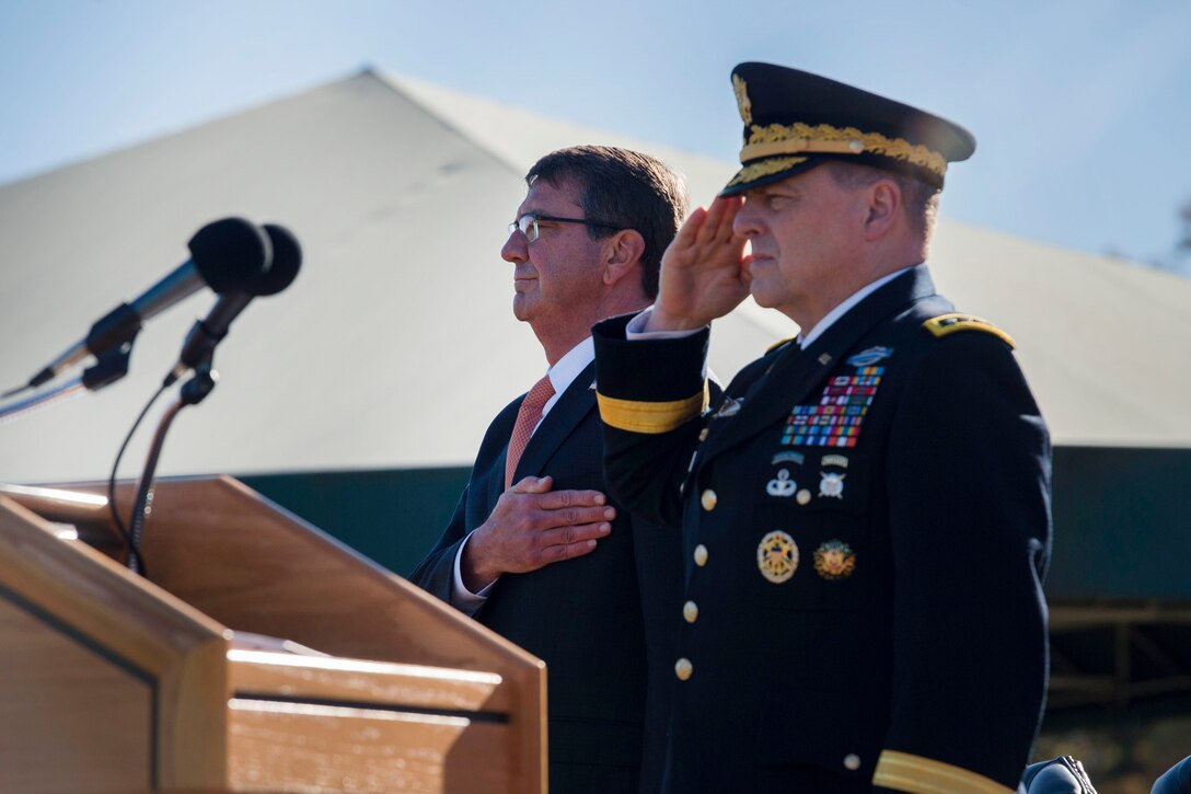 Defense Secretary Ash Carter and Army Chief of Staff Gen. Mark A. Milley render honors during the playing of the national anthem at the farewell ceremony honoring Army Secretary John M. McHugh on Joint Base Myer-Henderson Hall, Va., Oct. 23, 2015. DoD photo by Air Force Senior Master Sgt. Adrian Cadiz 