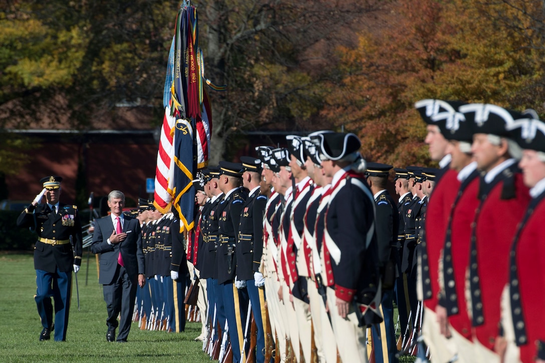 Army Secretary John M. McHugh reviews an Army honor guard formation during a farewell ceremony in his honor on Joint Base Myer-Henderson Hall, Va., Oct. 23, 2015. DoD photo by Air Force Senior Master Sgt. Adrian Cadiz