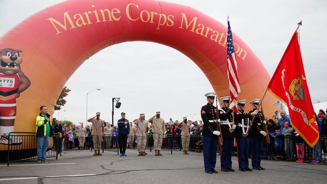 A color guard presents the Marine Corps Battle Colors during the Marine Corps Marathon Kid’s Run Oct. 24, 2015, at the Pentagon in Arlington, Virginia. More than 3,500 Children participated in the one-mile event. The run is organized to promote physical fitness and morale for the children and the community. 