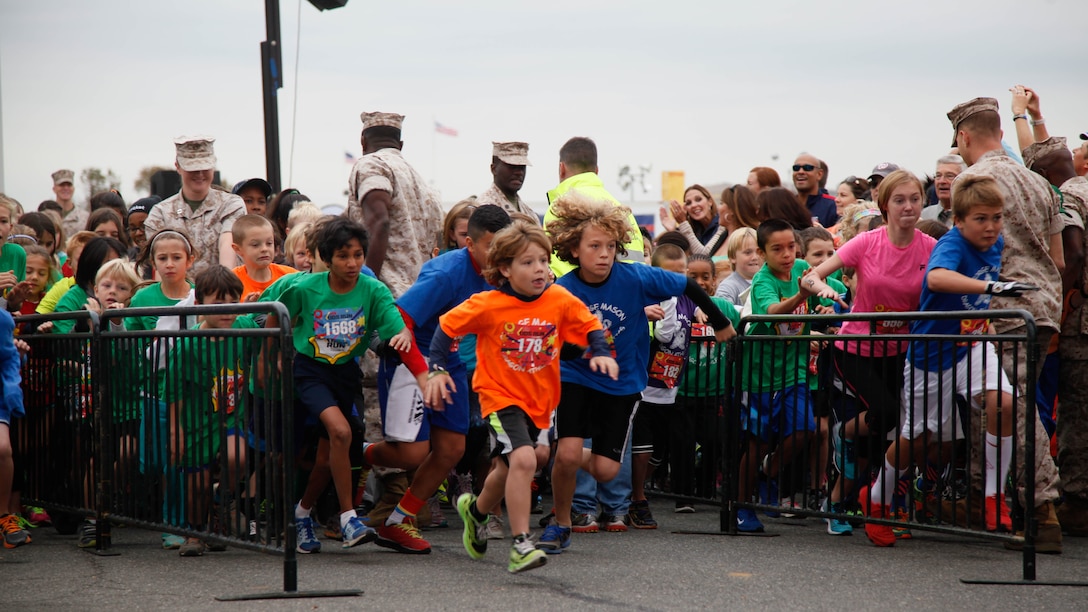 Children race through the starting line during the Marine Corps Marathon Kid’s Run Oct. 24, 2015, at the Pentagon in Arlington, Virginia. More than 3,500 Children participated in the one-mile event. The run is organized to promote physical fitness and morale for the children and the community. 