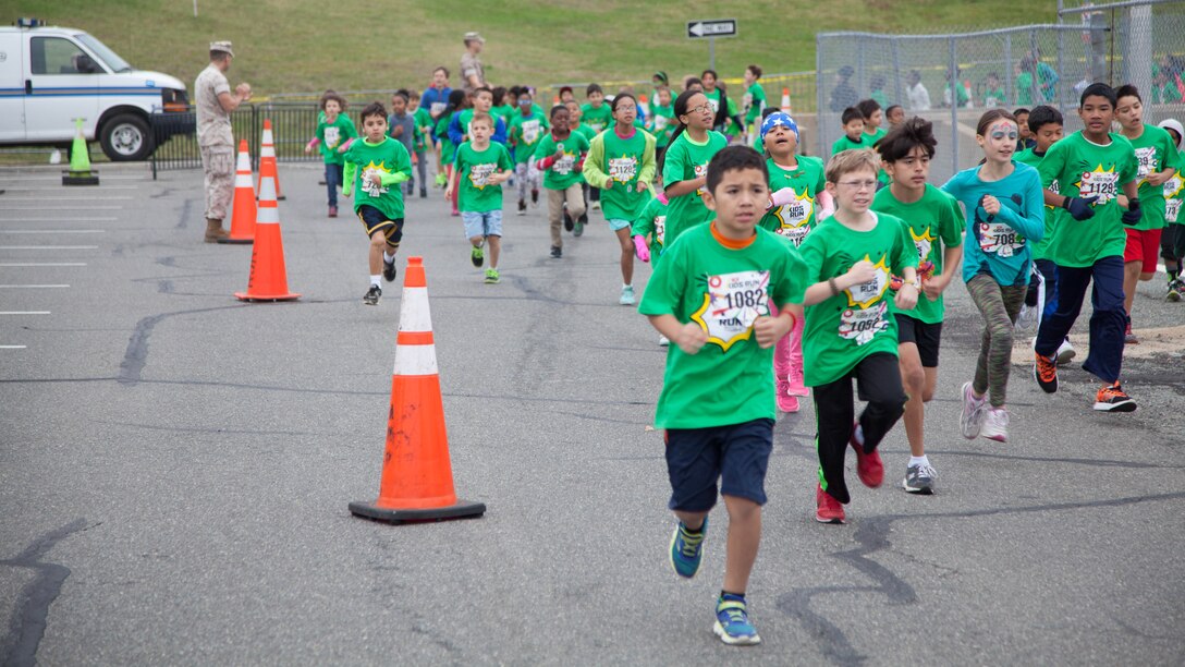 Children run through the Pentagon’s north parking lot during the Marine Corps Marathon Kid’s Run Oct. 24, 2015. More than 3,500 Children participated in the one-mile event. The run is organized to promote physical fitness and morale for the children and the community.