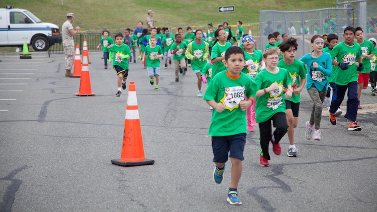 Children run through the Pentagon’s north parking lot during the Marine Corps Marathon Kid’s Run Oct. 24, 2015. More than 3,500 Children participated in the one-mile event. The run is organized to promote physical fitness and morale for the children and the community.