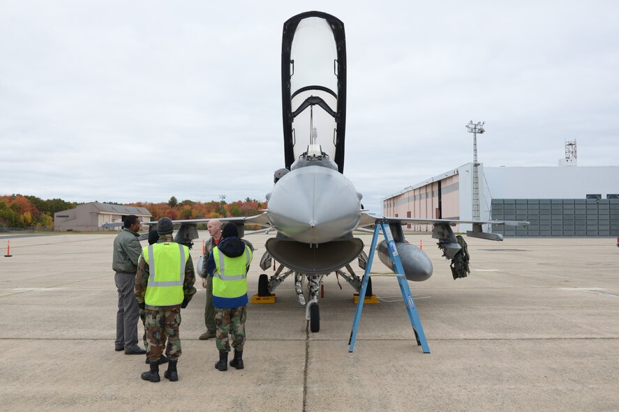 Lt. Col. Neal Snetsky, Chief of Safety, 119th Fighter Squadron, New Jersey Air National Guard talks to members of the Civil Air Patrol next to a F-16 Fighting Falcon at Portsmouth International Airport, Portsmouth, N.H. October 25, 2015. The seminar brought together military members and civilians to discuss how to avoid mid-air collisions between military and civilian aircrafts and to give civilian pilots an insight in to military aircrafts, operations and flight patterns. (N.H. Air National Guard photo by Airman Ashlyn J. Correia/Released) 