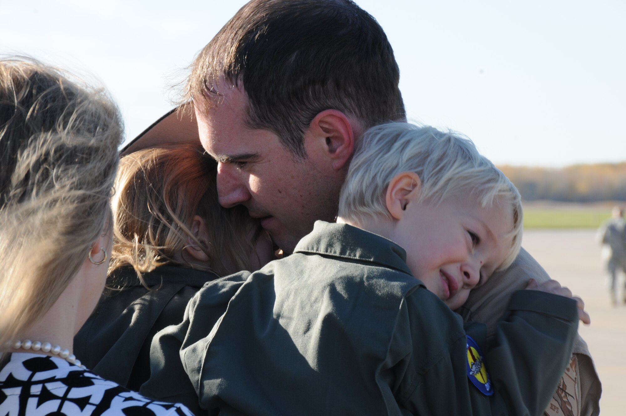 151022-Z-YW189-015– A pilot with the 127th Wing's 107th Fighter Squadron from Selfridge Air National Guard Base, Mich., reunites with his family after a six month deployment on October 22, 2015. Ten A-10 Thunderbolt II aircraft returned from a six-month deployment to Southwest Asia in support of U.S. Central Command’s Operation Inherent Resolve. (U.S. Air National Guard photo by Staff Sgt. Samara Taylor)