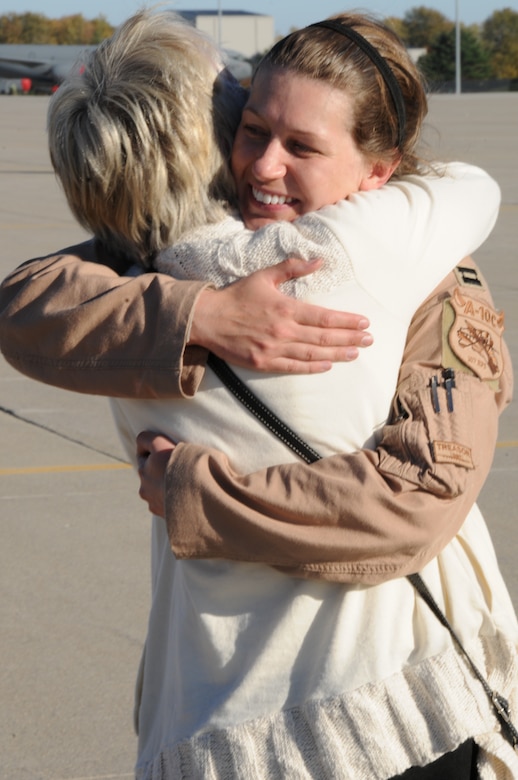 151022-Z-YW189-026 - – A pilot with the 127th Wing's 107th Fighter Squadron from Selfridge Air National Guard Base, Mich., reunites with her family after a six month deployment on October 22, 2015. Ten A-10 Thunderbolt II aircraft returned from a six-month deployment to Southwest Asia in support of U.S. Central Command’s Operation Inherent Resolve. (U.S. Air National Guard photo by Staff Sgt. Samara Taylor)