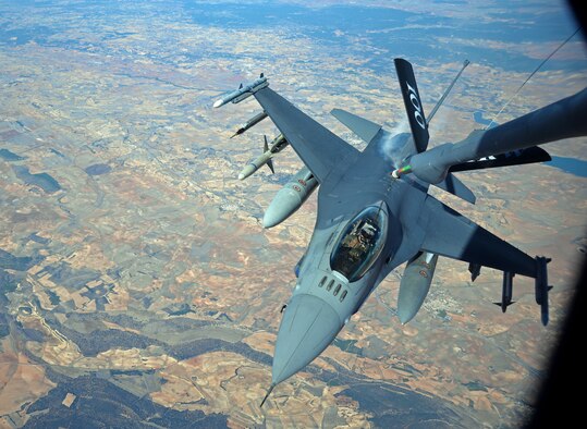 A U.S. Air Force F-16 Fighting Falcon from Spangdahlem Air Base, Germany, receives fuel from a KC-135 Stratotanker from RAF Mildenhall, England, Oct. 22, 2015, over Spain as part of Exercise Trident Juncture. With approximately 36,000 military personnel from more than 30 nations participating, Exercise Trident Juncture is a NATO-led exercise to help enhance the military interoperability and teamwork with NATO allies and partners. (U.S. Air Force photo by Senior Airman Christine Halan/Released)