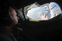 U.S. Air Force Master Sgt. Larry Nahalea, 351st Air Refueling Squadron boom operator, refuels an F-16 Fighting Falcon from Spangdahlem Air Base, Germany, Oct. 22, 2015 over Spain. Nahalea refueled nine aircraft during this particular mission as part of Exercise Trident Juncture. (U.S. Air Force photo by Senior Airman Christine Halan/Released)