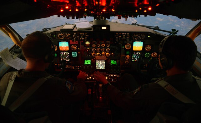 U.S. Air Force Capt. JohnMichael Ayers, 351st Air Refueling Squadron pilot, and U.S. Air Force Capt. Brian Dunn, 351st ARS instructor pilot, prepare a KC-135 Stratotanker for flight back to Son San Juan Air Base, Spain, Oct. 22, 2015, over Spain. The crew refueled F-16 Fighting Falcons from Spangdahlem Air Base, Germany, and a C-130 Hercules from RAF Mildenhall, England, as part of Exercise Trident Juncture. (U.S. Air Force photo by Senior Airman Christine Halan/Released) 