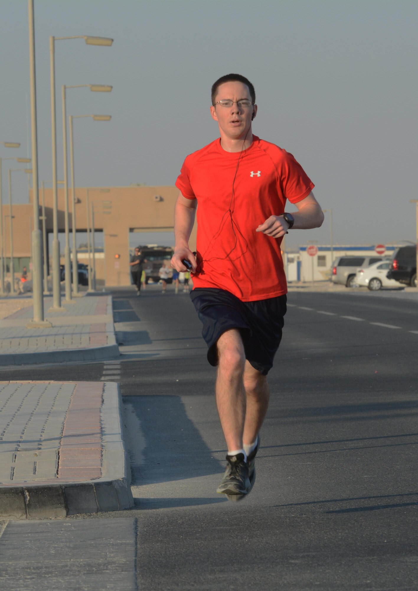 Capt. Michael Christopher, 557th Expeditionary Red Horse Squadron, races to the finish line of the Dignity and Respect 5K at Al Udeid Air Base, Qatar Oct. 23, 2015. The 3.1 mile race was organized to foster a culture of dignity and respect among service members. (U.S. Air Force photo by Tech. Sgt. James Hodgman/Released)