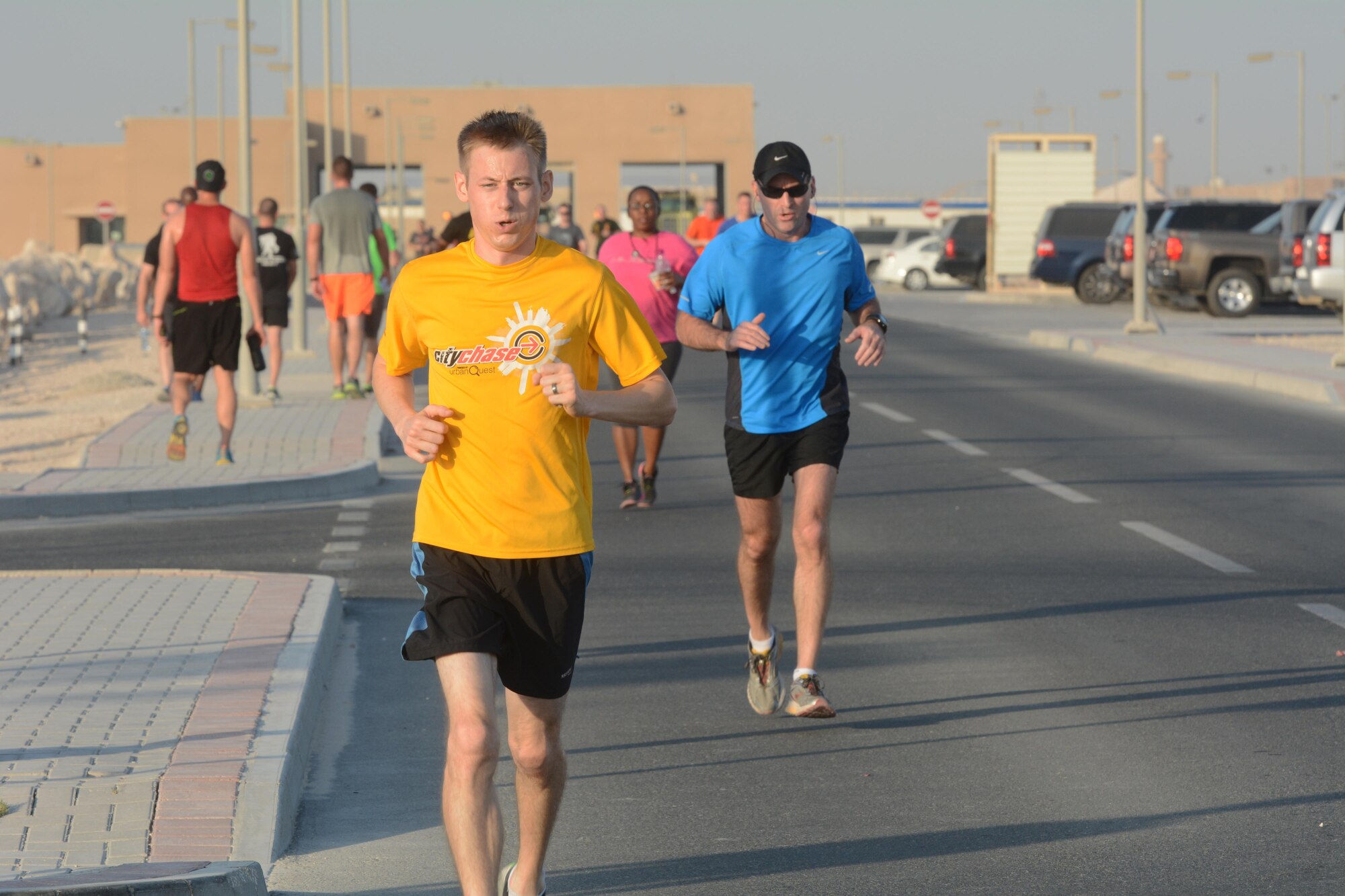 Runners race to the finish line of the Dignity and Respect 5K Oct. 23, 2015 at Al Udeid Air Base, Qatar. The 3.1 mile race was organized to foster a culture of dignity and respect among service members. (U.S. Air Force photo by Tech. Sgt. James Hodgman/Released)
