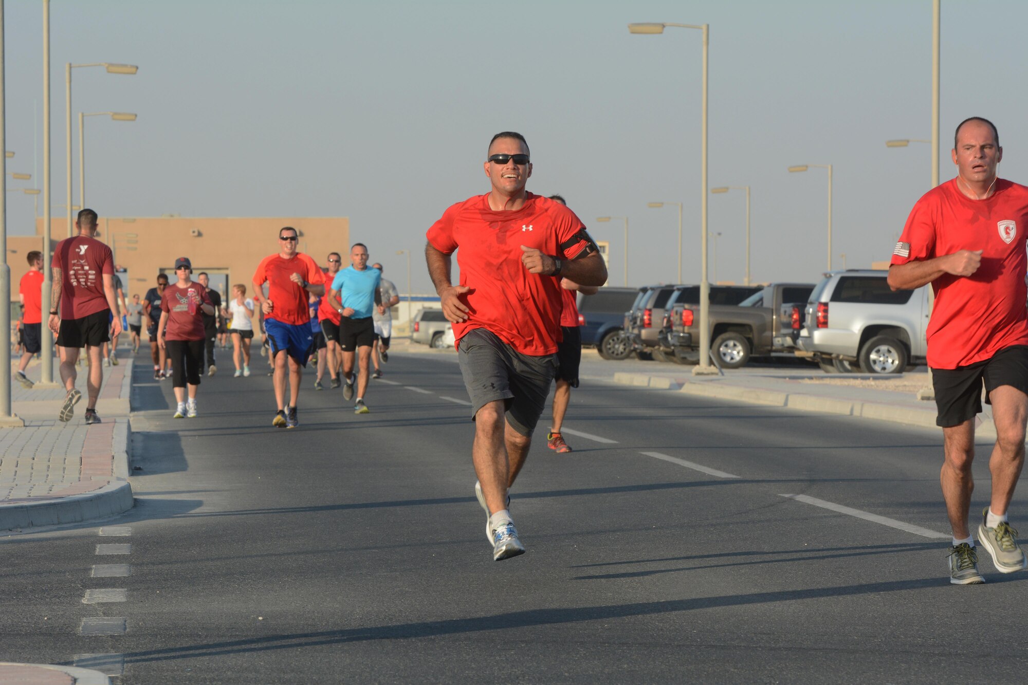 Runners race to the finish line of the Dignity and Respect 5K Oct. 23, 2015 at Al Udeid Air Base, Qatar. The 3.1 mile race was organized to foster a culture of dignity and respect among service members. (U.S. Air Force photo by Tech. Sgt. James Hodgman/Released)
