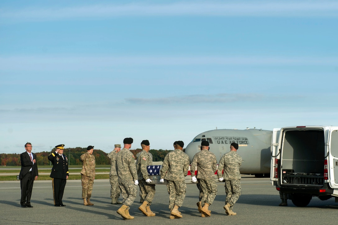 Defense Secretary Ash Carter and Army Chief of Staff  Gen. Mark A. Milley salute as an Army carry team moves the transfer case of U.S. Army Master Sgt. Joshua L. Wheeler during the dignified transfer of his remains at Dover Air Force Base, Del., Oct. 24, 2015. DoD photo by Air Force Senior Master Sgt. Adrian Cadiz 
