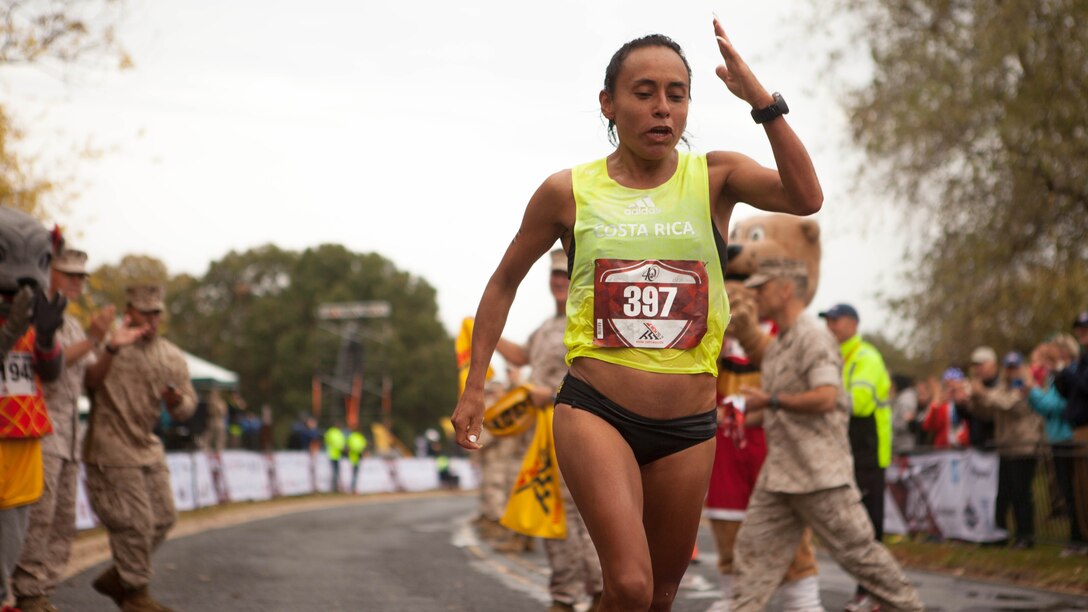 Jenny Mendez Suarez, the first female finisher, completes 40th Marine Corps Marathon at Arlington, Virginia, Oct. 25. Mendez Suarez finished the 26.2-mile race in 2:45. This year’s participants joined the 512,370 runners, who have completed the “Marathon of the Monuments” since its inaugural event in 1976.