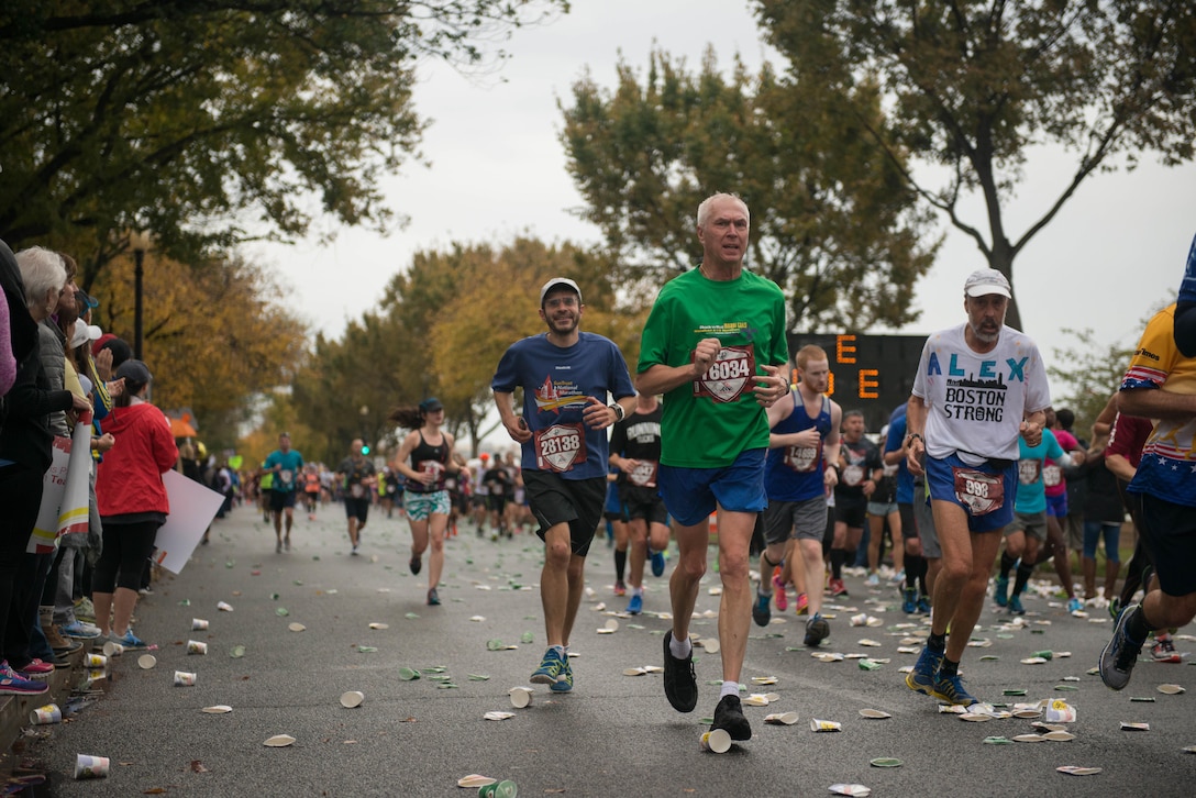 Runners race through Washington during the Marine Corps Marathon, Oct. 25, 2015. More than 30,000 runners dashed 26.2 miles through Washington and Arlington, Virginia, during this year’s race, which marked the 40th running of the “The Peoples Marathon.”
