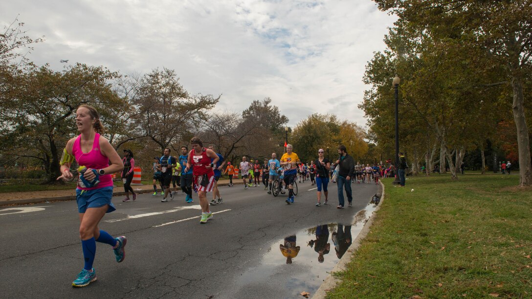Runners race through Washington during the Marine Corps Marathon, Oct. 25, 2015. More than 30,000 runners dashed 26.2 miles through Washington and Arlington, Virginia, during this year’s race, which marked the 40th running of the “The Peoples Marathon.”
