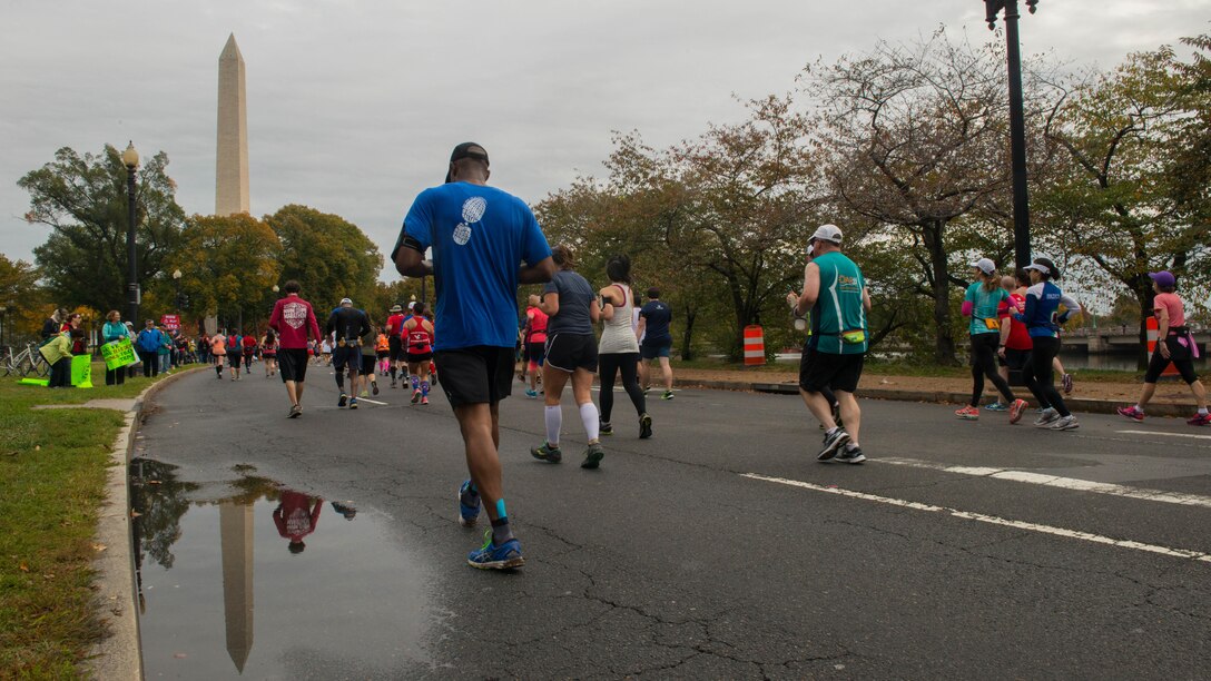 Runners race through Washington during the Marine Corps Marathon, Oct. 25, 2015. More than 30,000 runners dashed 26.2 miles through Washington and Arlington, Virginia, during this year’s race, which marked the 40th running of the “The Peoples Marathon.”