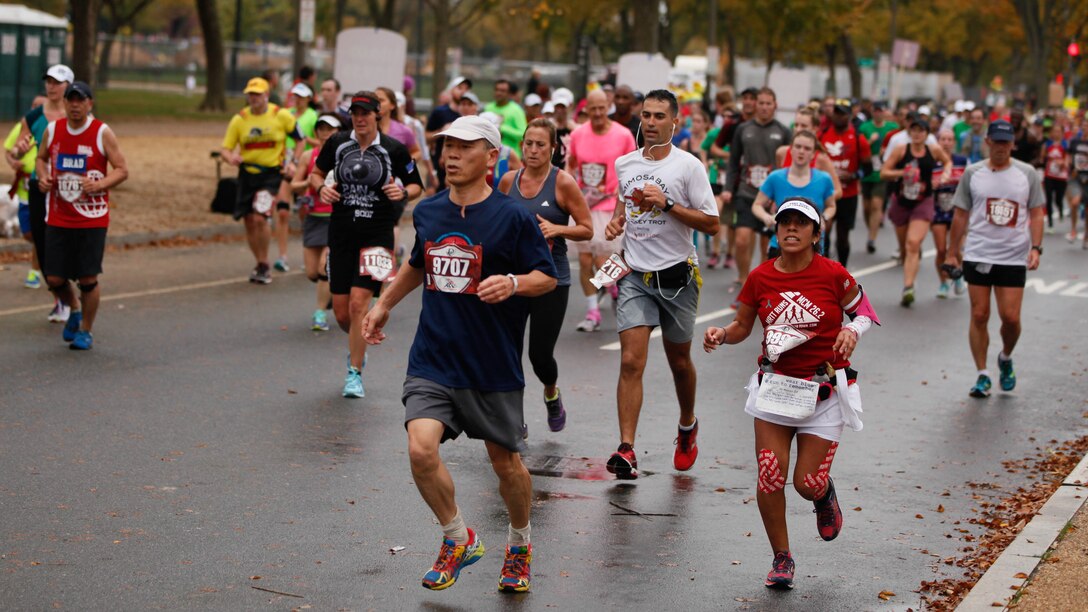 Participants of the 40th Marine Corps Marathon run through the National Mall in Washington, Oct. 25, 2015. More than 30,000 men and women ran in this year’s marathon. 