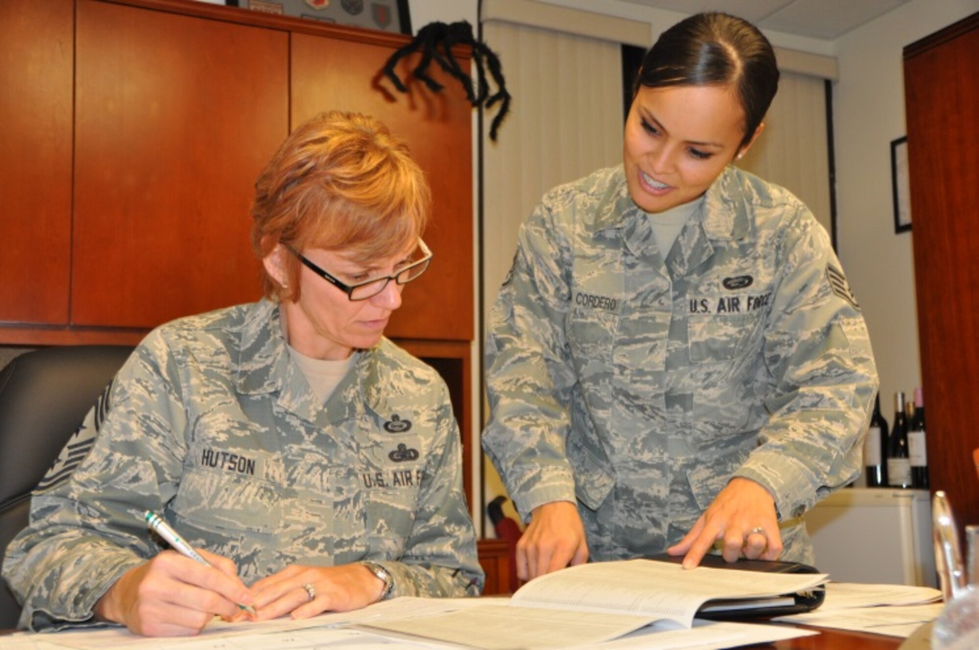 Staff Sgt. Perla Tapia, CFC Coordinator for the 944th Fighter Wing Staff agencies briefs Chief Master Sgt. Rhonda Hutson, 944 FW Command Chief on the CFC program. The chief believes that the CFC is important because it not only helps at the federal level can help those in need right here at the Wing. (U.S. Air Force photo taken by Tech. Sgt. Barbara Plante)