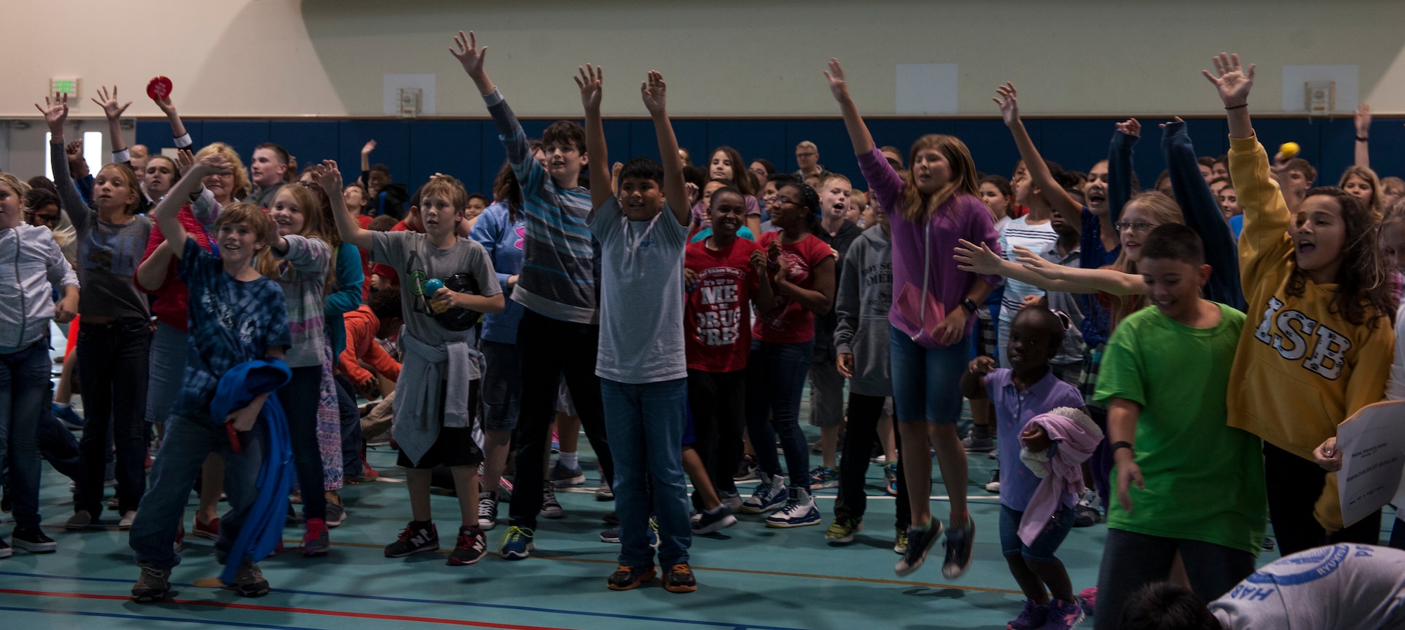 Students at Ryukyu and Kadena Middle School receive souvenirs during the Red Ribbon Week kick off rally at Ryukyu and Kadena Middle School Oct. 23, 2015, on Kadena Air Base, Japan. Red Ribbon Week is held to educate children about the importance of drug prevention. Red Ribbon Week runs through Oct. 30 and is a national campaign to educate youth about the importance of being drug-free.  (U.S. Air Force photo by Airman 1st Class Lynette M. Rolen)
