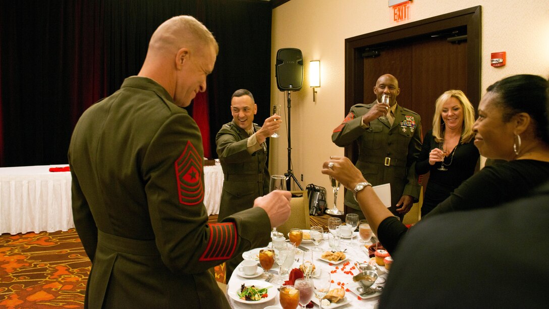 Col. Joseph M. Murray, center-left, commander, Marine Corps Installations National Capital Region-Marine Corps Base Quantico, toasts to the most recent inductees to the Marine Corps Hall of Fame during a Marine Corps Hall of Fame dinner and ceremony at the Hyatt Regency Reagan National Airport in Crystal City, Va., Oct. 23, 2015. Chas Henry and Jeff Galloway were inducted for their respective contributions to the marathon over the years.
