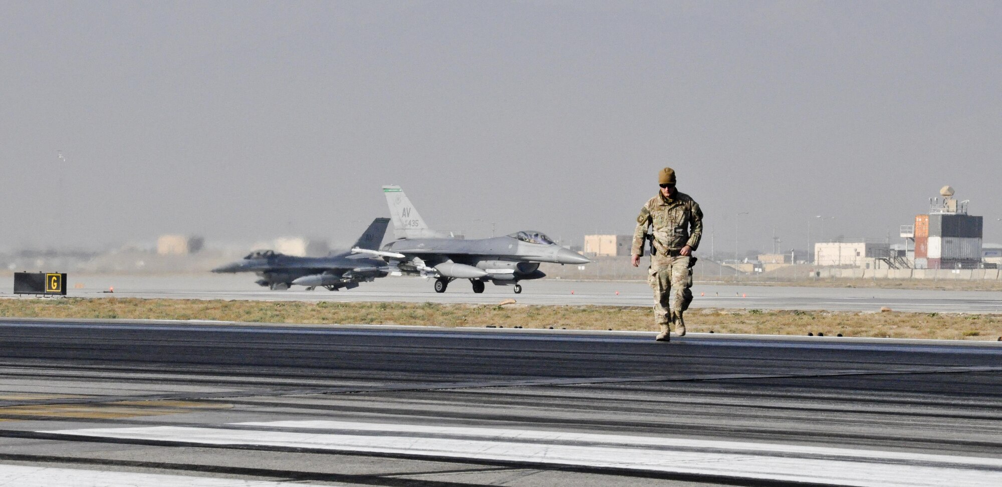 Tech. Sgt. Christopher Fitzgerald, 577th Expeditionary Prime Base Engineer Emergency Force Squadron from Al Udeid Air Base, Qatar, deployed from Shaw Air Force Base, S.C., inspects the runway as rubber is removed Oct. 22, 2015, at Bagram Airfield, Afghanistan. Foam and biodegradable solvents are used to strip the rubber left behind by the aircraft that land or take off from Bagram in support of Operation Freedom’s Sentinel and NATO’s Resolute Support mission. (U.S. Air Force photo by Tech. Sgt. Nicholas Rau/Released)