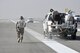 Airmen from the 455th Expeditionary Civil Engineer Squadron paint the runway markings Oct. 22, 2015, at Bagram Airfield, Afghanistan. The paint used is mixed with reflective beads to ensure that the markings can be seen by the pilots coming and going from Bagram in support of Operation Freedom’s Sentinel and NATO’s Resolute Support mission. (U.S. Air Force photo by Tech. Sgt. Nicholas Rau/Released)