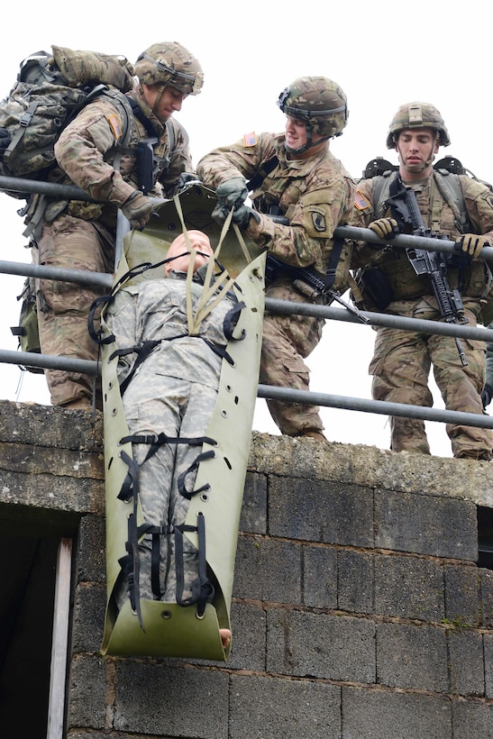 U.S. soldiers lower a mannequin during the European Best Squad Competition at the Grafenwoehr Training Area in Bavaria, Germany, Oct. 20, 2015. U.S. Army photo by Gertrud Zach