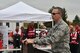 Col. Kevin Riley, 910th Mission Support Group commander, addresses attendees of the 2nd annual Feel the Heat event here, Oct. 22, 2015. Feel the Heat is an interactive training and demonstration event involving the 910th Airlift Wing and the American Red Cross Lake to River Chapter. During the event, the 910th Civil Engineer Squadron Fire Department ignited a mock training aircraft and responded with vehicles and personnel to combat the blaze and rescue victims. (U.S. Air Force photo/Eric M. White)