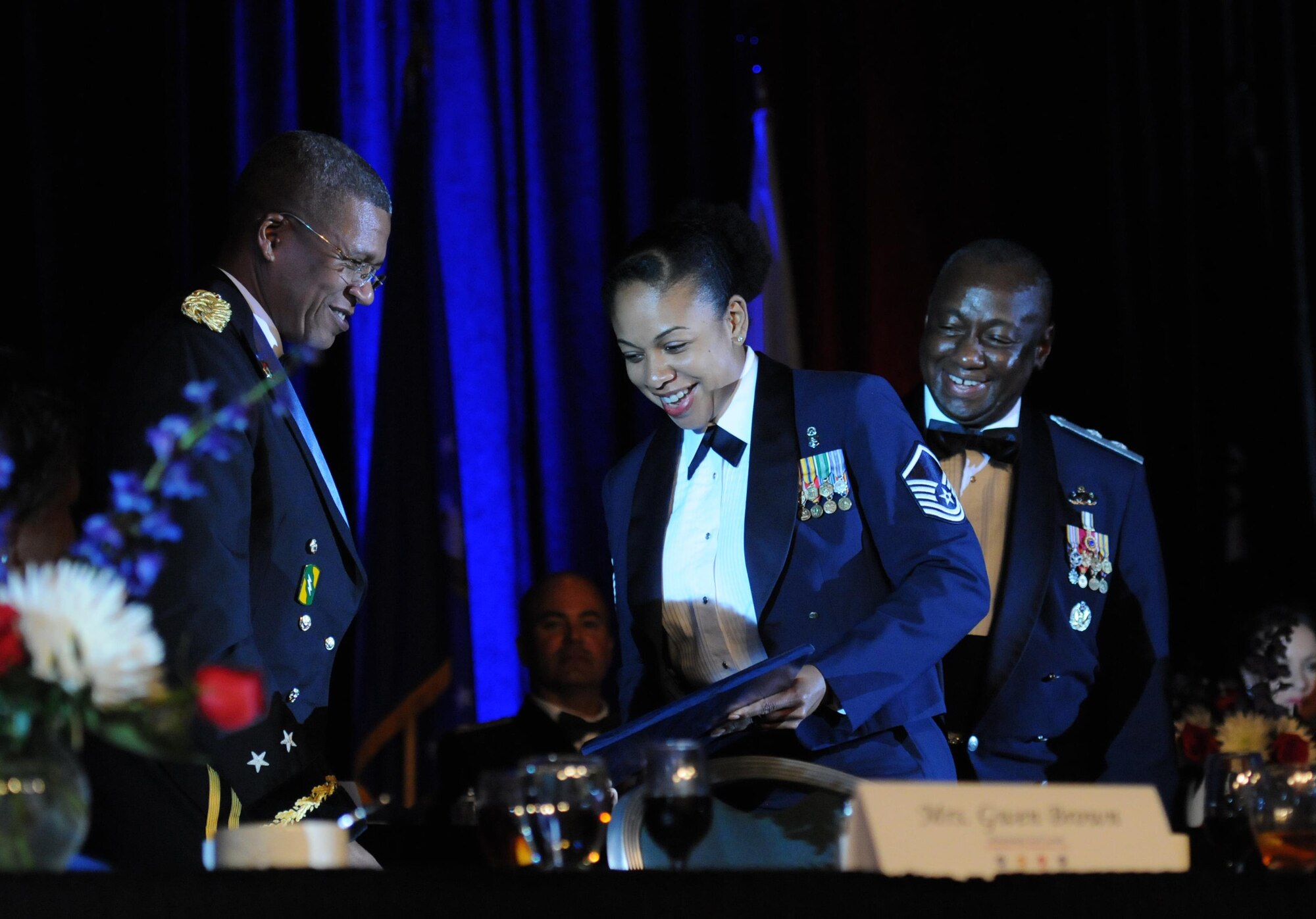 Master Sgt. Tammy Pierce, 81st Inpatient Operation Squadron medical and surgical inpatient flights flight chief, Keesler Air Force Base, Miss., receives a plaque from members of the head table during the 37th Annual Salute to the Military at the Mississippi Coast Convention Center, Oct. 20, 2015, Biloxi, Miss. Pierce was recognized as the winner of the Thomas V. Fredian Community Leadership Award at the event. The Salute to the Military recognizes the men and women who make up our military along the Gulf Coast. (U.S. Air Force photo by Kemberly Groue)