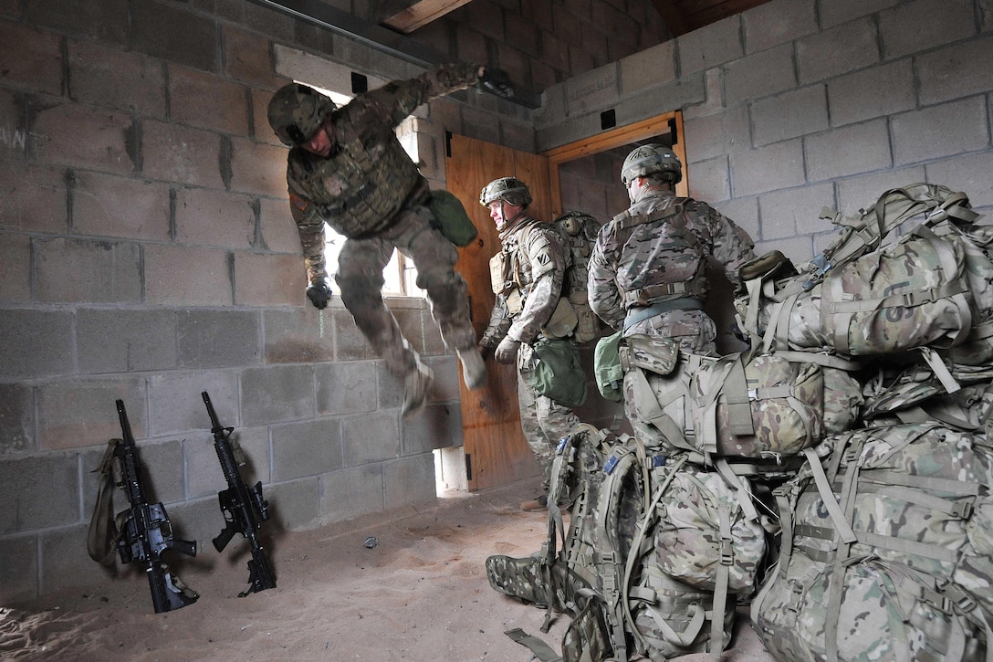 U.S. soldiers participate in an urban casualty evacuation during the European Best Squad Competition at the Grafenwoehr Training Area in Bavaria, Germany, Oct. 20, 2015. U.S. Army photo by Gertrud Zach