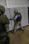 Austrian soldiers assigned to the Kosovo Force International Military Police conduct building-clearance training alongside U.S. Army Military Police Soldiers, as well as military working dogs and handlers, Sept. 30, 2015, on Camp Bondsteel, Kosovo. The U.S. soldiers are currently deployed to Kosovo with Multinational Battle Group-East, part of NATO’s KFOR peace support mission. The day’s training was conducted to ensure the military police teams are familiar with military working dog procedures while responding to active-shooter or explosive ordnance situations. (U.S. Army photo by Sgt. Erick Yates, Multinational Battle Group-East)