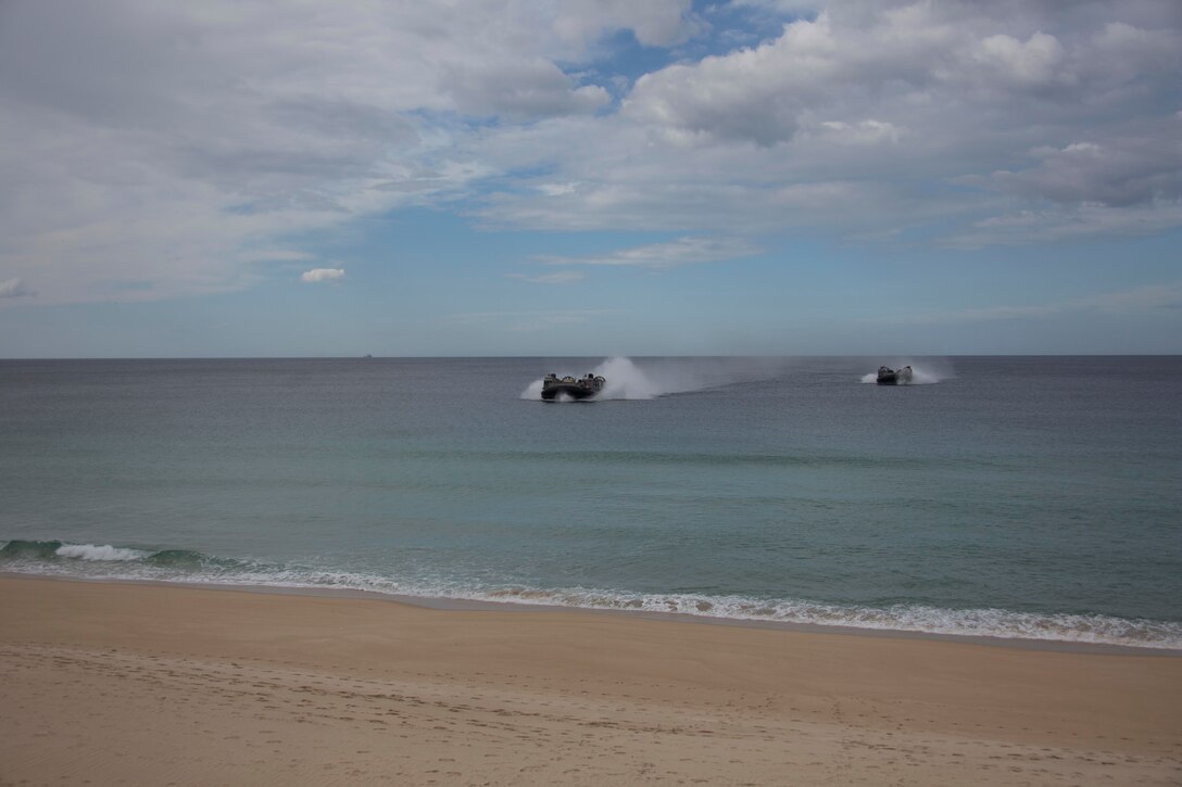 U.S. and Portuguese Marines in Landing craft air cushions from the USS Arlington and the USS Kearsarge Amphibious Ready Group move towards Pinheiro Da Cruz Beach, Portugal, Oct. 20, 2015.
The Marines participated in a combined amphibious assault exercise during Trident Juncture 15. The NATO-led exercise certifies response forces and develops interoperability among participating NATO partner nations.
