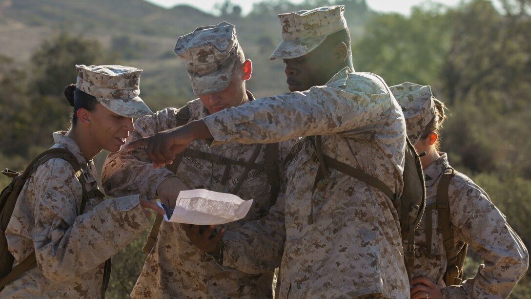 Students of Combat Logistics Battalion 1 Corporals Course find points on a map and determine their relative direction during a land-navigation exercise aboard Marine Corps Base Camp Pendleton, Calif., Oct. 23, 2015. The first CLB-1 Corporals Course class is scheduled to graduate Oct. 30, and is designed to help noncommissioned officers learn new leadership techniques.