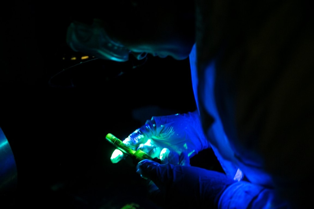 GULF OF OMAN (Oct. 25, 2015) U.S. Marine Sgt. Taylor Harris inspects an M240B machine gun bolt stud aboard the amphibious assault ship USS Essex (LHD 2). Harris is a non-destructive inspection technician with Medium Marine Tiltrotor Squadron 161 (Reinforced), 15th Marine Expeditionary Unit. She inspected the bolt for any cracks or discrepancies to ensure the M240 functions properly. The 15th MEU, embarked on the ships of the Essex Amphibious Ready Group, is deployed to maintain regional security in the U.S. 5th Fleet area of operations. (U.S. Marine Corps photo by Sgt. Anna Albrecht/ Released)