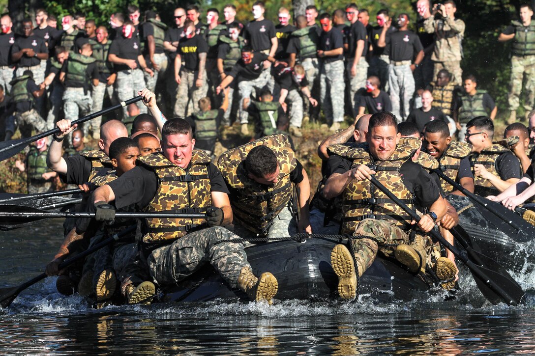 Paratroopers begin paddling during the annual "Crossing of the Wall River" boat competition on Fort Bragg, N.C., Oct. 21, 2015. The paratroopers are assigned to the 82nd Airborne Division's 307th Engineer Battalion, 3rd Brigade Combat Team. Seven teams from the battalion crossed Kiest Lake to replicate the five trips across the Waal River made by 307th Engineer Battalion veterans during Operation Market Garden in World War II. U.S. Army photo by Sgt. Anthony Hewitt