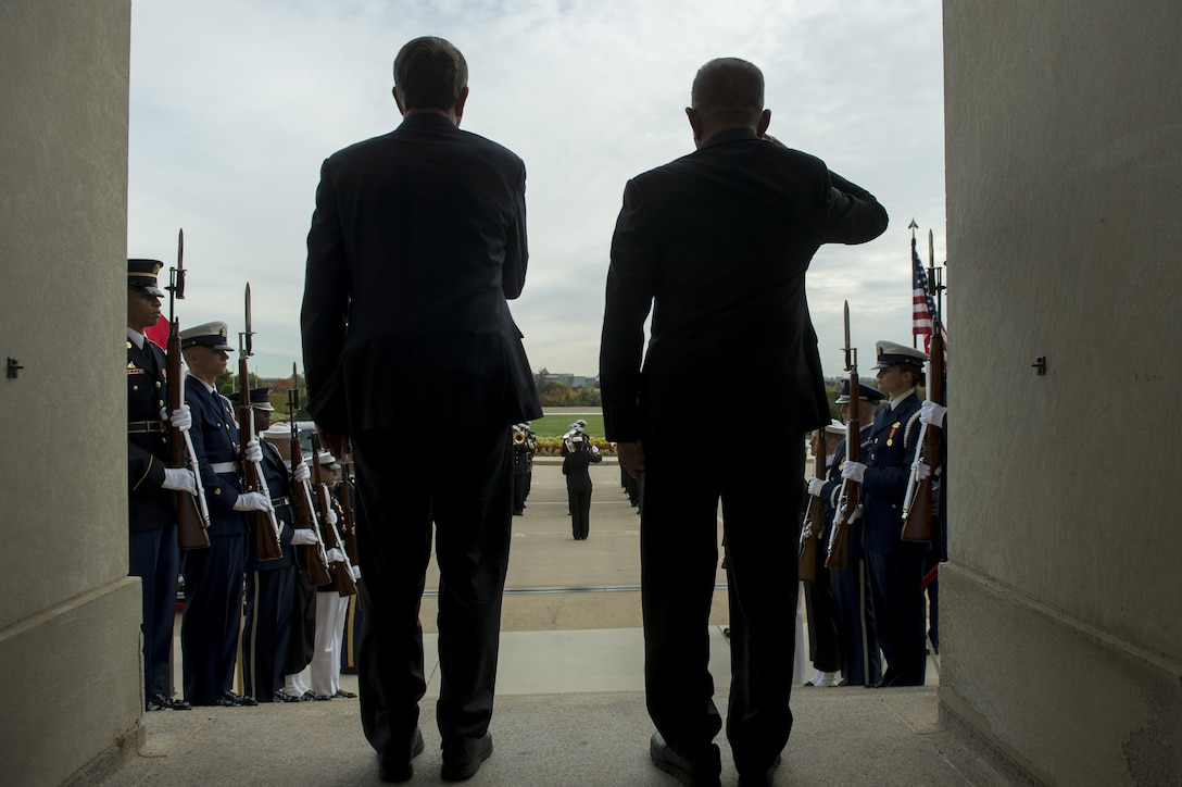 U.S. Defense Secretary Ash Carter, left, and Indonesian Defense Minister Ryamizard Ryacudu render honors as the national anthem of each country is played during an honor cordon at the Pentagon, Oct. 26, 2015. The two leaders met to discuss matters of mutual importance and to sign the Joint Statement on Comprehensive Defense Cooperation. DoD photo by U.S. Air Force Senior Master Sgt. Adrian Cadiz