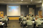 Air Force Col. Joseph Rizzuto, director, Profession of Arms Career Center of Excellence, speaks with newly appointed chief master sergeants during the Chief's Executive Course at the Air National Guard Readiness Center, Joint Base Andrews, Md., Oct. 20, 2015.  The purpose of the CEC is to provide new Chief Master Sergeants with a broad view of operations at a strategic level. 