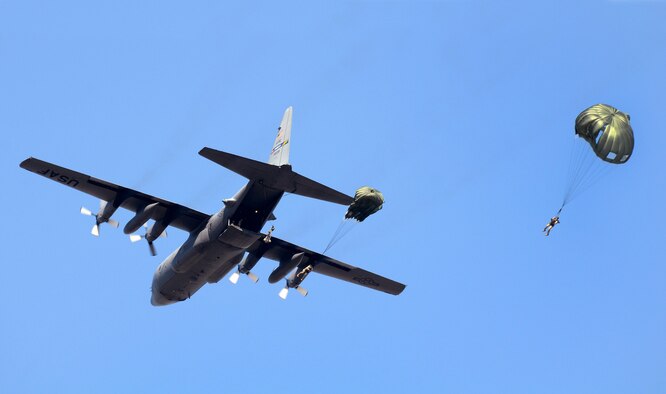 Marines from Bravo Company, 4th Recon Battalion, 4th Marine Division, Marine Forces Reserve, Smyrna, Ga., jump from a C-130H3 from the 94th Airlift Wing at Dobbins Air Reserve Base, Ga., Oct 15, 2015. The Marines were performing static line parachute recertification jumps to a landing zone on Dobbins ARB. (U.S. Air Force photo/ Don Peek)