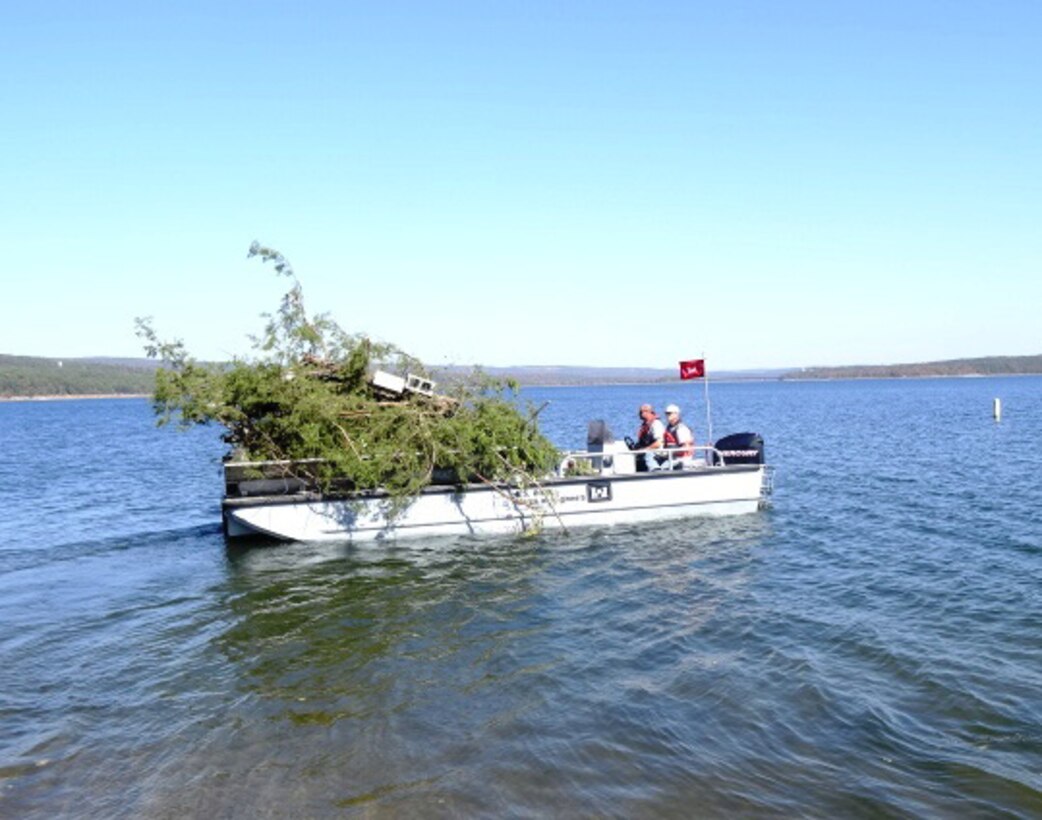 The Army Corps of Engineers, Greers Ferry Project Office rangers place a new fish structure in Higden Bay on Greers Ferry Lake to provide additional habitat for the fishery. PVC pipe structures and cedar trees were used to construct the fish habitats. These structures will attract algae, small insects, and bait fish which in turn will attract larger fish. 					