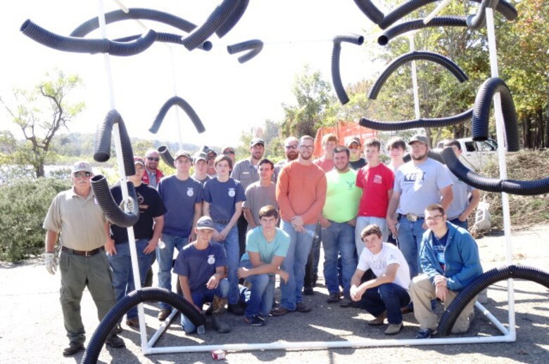 The Army Corps of Engineers, Greers Ferry Project Office personnel, the Heber Springs High School Future Farmers of America Club members as well as several volunteer groups recently placed new fish structures in Higden Bay on Greers Ferry Lake to provide additional habitat for the fishery. PVC pipe structures and cedar trees were used to construct the fish habitats. All of these structures will attract algae, small insects, and bait fish which in turn will attract larger fish. 					