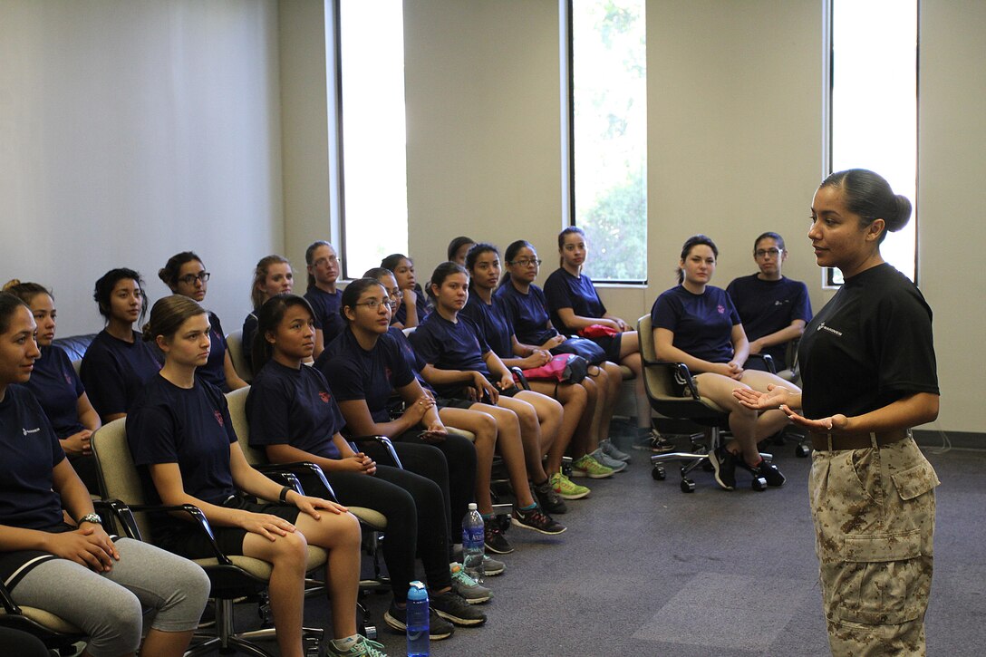 Staff Sgt. Maria E. GarciaRazo, staff noncommissioned officer in charge of Recruiting Sub Station Hollywood, speaks with poolees during a female pool function at Recruiting Station Los Angeles, Oct. 24, 2015, to build camaraderie and spread knowledge about the Marine Corps. (Official U.S. Marine Corps photo/Released)
