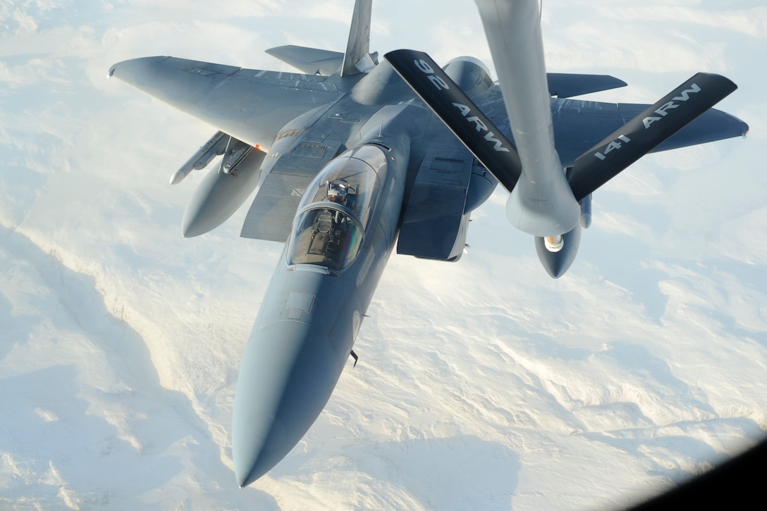 U.S. Air National Guard 1st Lt. Johnathan Pavan, 194th Fighter Squadron pilot, flies an F-15C Eagle during an aerial refueling mission with a KC-135 Stratotanker over northern Canada, Oct. 20, 2015. Approximately 700 members of the Canadian Armed Forces, U.S. Air Force, U.S. Navy, and U.S. Air National Guard participated in Exercise Vigilant Shield 16. U.S. Air Force photo by Senior Airman Victor J. Caputo